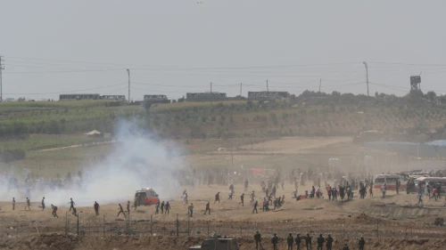 Palestinians burn tires as they protest by the fence on the border between Gaza and Israel, as seen from the Israeli side of the border, June 8, 2018. Photo by Yonatan Sindel/Flash90.