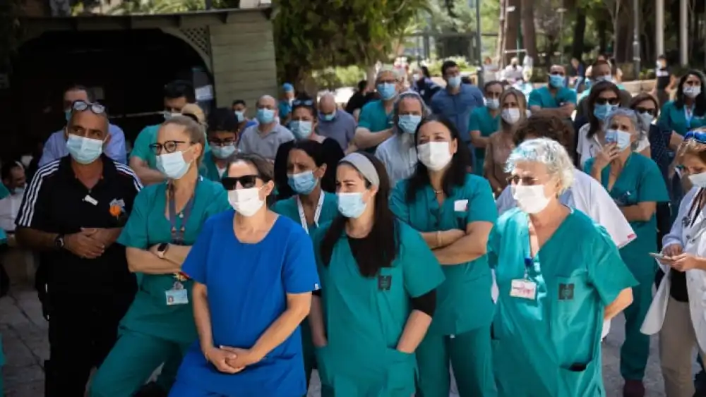 Doctors and nurses strike outside the Hadassah hospital in Jerusalem on Aug. 25, 2021. Staff at public hospitals all over Israel were protesting the lack of budget for the Israeli healthcare system. Photo by Yonatan Sindel/Flash90.