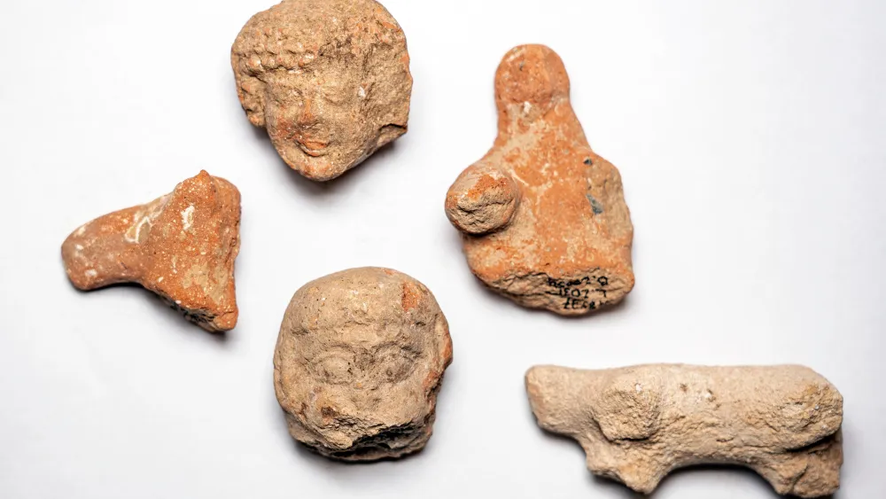 Clay figurines of women and animals found at the Armona excavation site in Jerusalem, July 2020. Credit: Yaniv Berman, Israel Antiquities Authority.