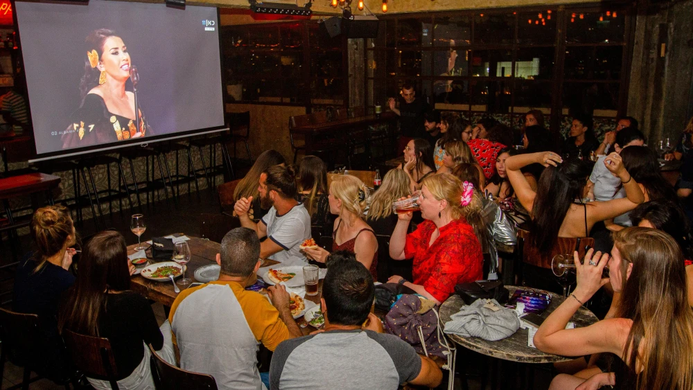 People watch the final of the 2019 Eurovision Song Contest at a pub in Tel Aviv on May 18, 2019. Credit: Flash90