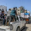 Armed and masked Palestinians on trucks loaded with humanitarian aid entering southern Gaza through the Kerem Shalom Crossing from Israel, April 3, 2024. Photo by Abed Rahim Khatib/Flash90.