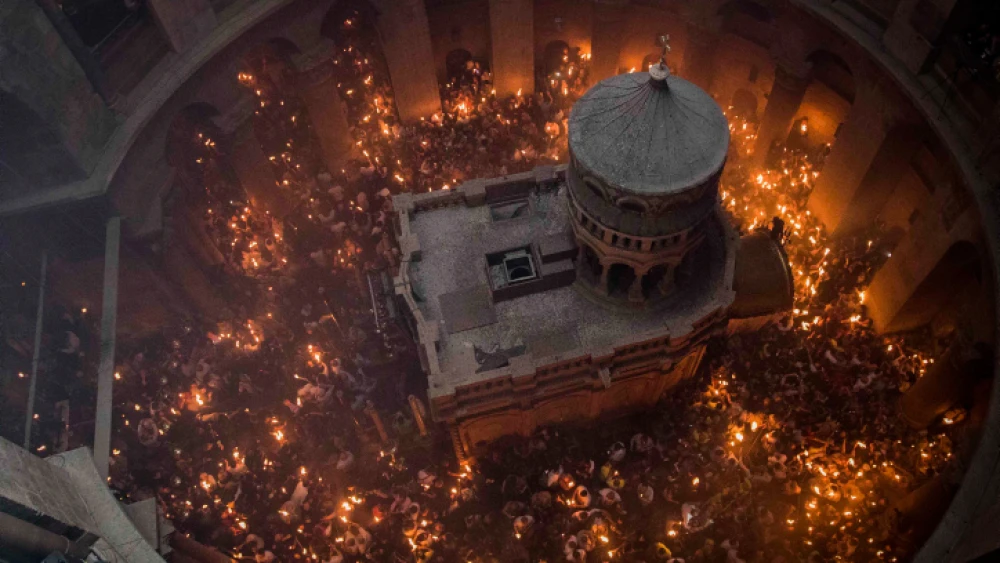 Thousands of Orthodox Christian worshippers take part in the Holy Fire ceremony at the Church of the Holy Sepulchre in Jerusalem’s Old City during the Easter holiday on April 7, 2018. Photo by Flash90.