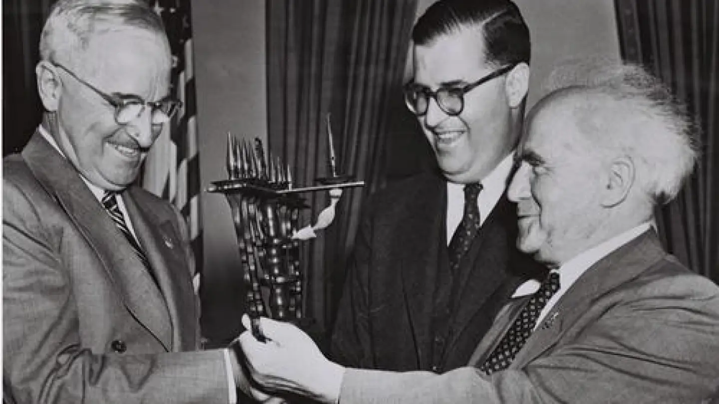 U.S. President Harry S. Truman, Israeli Ambassador to the United States Abba Eban and Israeli Prime Minister David Ben-Gurion in the White House on May 1, 1951. The Israeli leaders presented Truman with a menorah. Credit: Fritz Cohen via Wikimedia Commons.