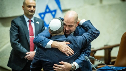 Knesset Speaker Amir Ohana (facing the camera) and Minister of National Security Itamar Ben-Gvir embrace at the swearing-in ceremony for the Netanyahu government at the Knesset in Jerusalem, Dec. 29, 2022. Photo by Yonatan Sindel/Flash90.