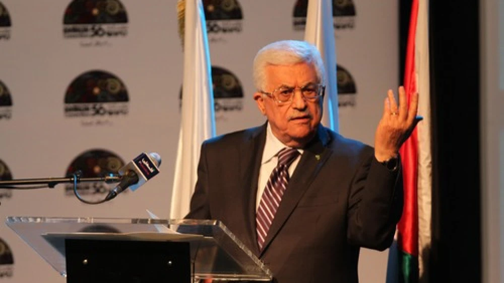 Palestinian Authority leader Mahmoud Abbas gestures as he speaks during a conference in Ramallah on June 19, 2014. Credit: Issam Rimawi/Flash90.