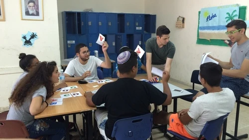 Zach Katz (second from right, standing) of Bergenfield, N.J., and Elan Rotenberg (far right) of Baltimore, Md., run an English class for Counterpoint Israel campers in Kiryat Gat. Credit: Courtesy.
