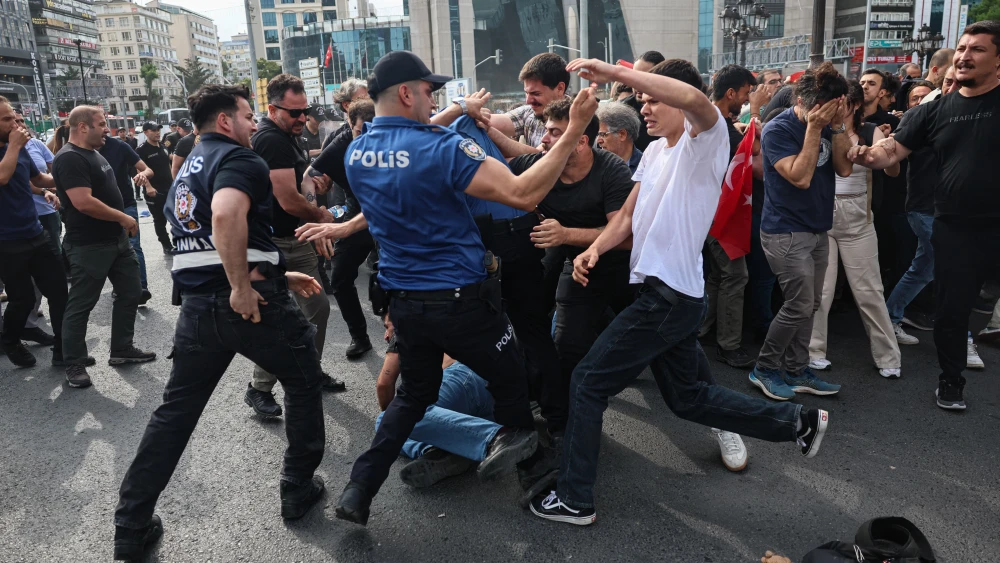 Turkish police officers (L) and demonstrators clash during an anti-NATO demonstration in Ankara, ahead of a NATO summit, on July 5, 2026. Photo by Adem Altan / AFP via Getty Images.