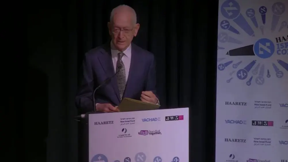 Amos Schocken speaks at the conference, "Israel After October 7: Allied or Alone?," in London, Oct. 27, 2024. Credit: YouTube/Haaretz.