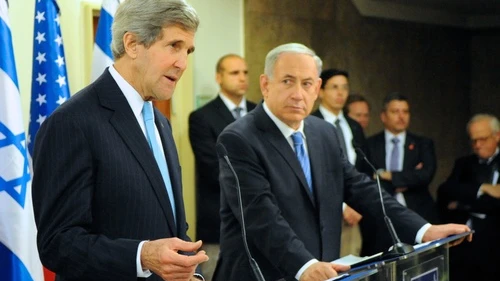 Israeli Prime Minister Benjamin Netanyahu looks on as U.S. Secretary of State John Kerry addresses reporters before a series of meetings at the Prime Minister's office in Jerusalem on January 2, 2014. Kerry recently came under fire for saying that Israel could become an "apartheid state" if a two-state solution is not reached soon. Credit: U.S. State Department.