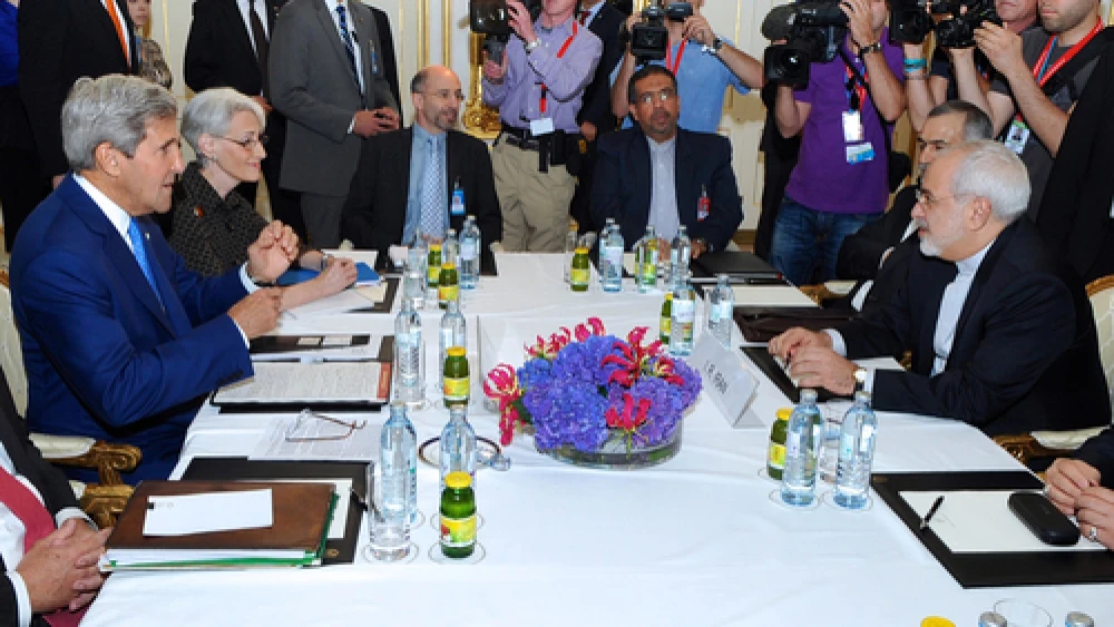 U.S. Secretary of State John Kerry (center left) prepares to sit down with Iranian Foreign Minister Mohammad Javad Zarif (center right) in Vienna, on July 14, 2014, before they begin a bilateral meeting focused on Iran's nuclear program. Credit: U.S. State Department.