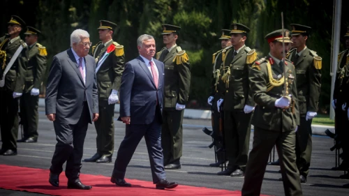 Palestinian Authority leader Mahmoud Abbas and Jordanian King Abdullah II review an honor guard in Ramallah, Aug. 7, 2017. Credit: Flash90.
