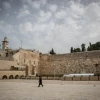 A Jewish man walks at the almost empty Western Wall, in the Old City of Jerusalem, March 27, 2020. Photo by Yonatan Sindel/Flash90.