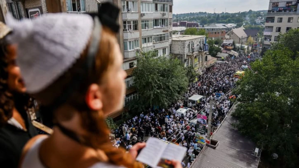 Jewish men in the street during the Tikkun HaKlali recitation of Psalms near the tomb of Rabbi Nachman of Breslov in Uman, Ukraine, on the eve of Rosh Hashanah, Sept.15, 2023. Photo by Chaim Goldberg/Flash90.