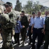 Head of Palestinian national security forces in Hebron Brig. Gen. Hazem Abu Hanood and head of the Palestinian police Brig. Gen. Ahmad Abu Rob talk to residents during a visit to the Old City in Hebron on July 31, 2018. Photo by Wisam Hashlamoun/Flash90.