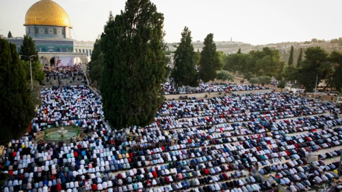 Muslims pray in front of the Dome of the Rock at the Al-Aqsa mosque in Jerusalem during the Muslim holiday of Eid al-Fitr, marking then end of the month of Ramadan, June 5, 2019. Photo by Sliman Khader/Flash90.