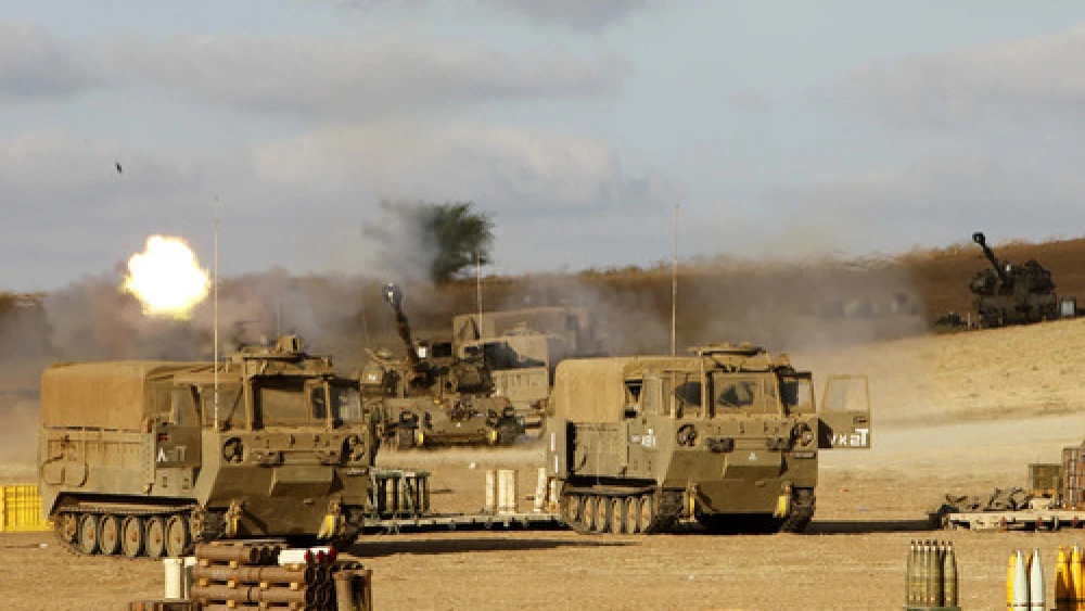 The Israel Defense Forces Artillery Corps fires shells at Gaza on July 18, 2014, after Israeli forces began a ground invasion into northern Gaza amid "Operation Protective Edge." Following the operation, Hamas continues to control Gaza and openly considers any truce with Israel as a time to re-arm for the next conflict. Credit: Miriam Alster/Flash90.