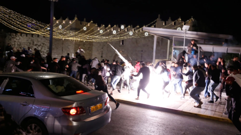 Israeli police clash with rioters outside Damascus Gate in Jerusalem on April 22, 2021. Photo by Jamal Awad/Flash90.