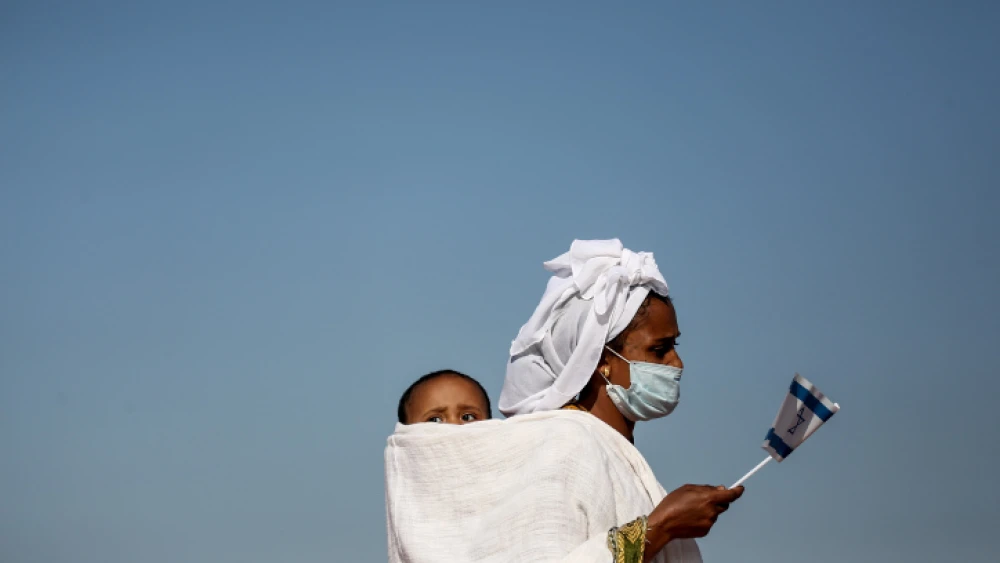 Members of the Falash Mura community arrive at Ben-Gurion International Airport on Dec. 3, 2020. Photo by Miriam Alster/Flash90.