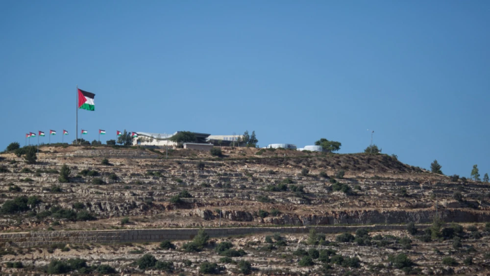 View of the Palestinian flag in the Palestinian city of Rawabi, as seen from the the Jewish community of Ateret, in the Binyamin District in Samaria, July 11, 2018. Photo by Hadas Parush/Flash90.