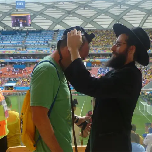 Among the thousands of Jewish fans traveling to the World Cup will be many Westerners and Israelis who have never been to Russia. Chabad centers around the country are preparing to welcome them and encourage them to explore all aspects of Jewish life, as Chabad representatives did four years ago at the World Cup games in Brazil, above. (Chabad.org)