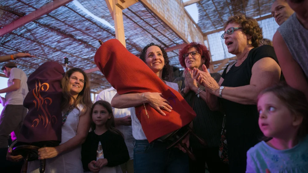 Simchat Torah celebrations inside a “sukkah” at the Tel Aviv port, organized by the Beit Tefila Israeli community. Photo by Miriam Alster/Flash90.