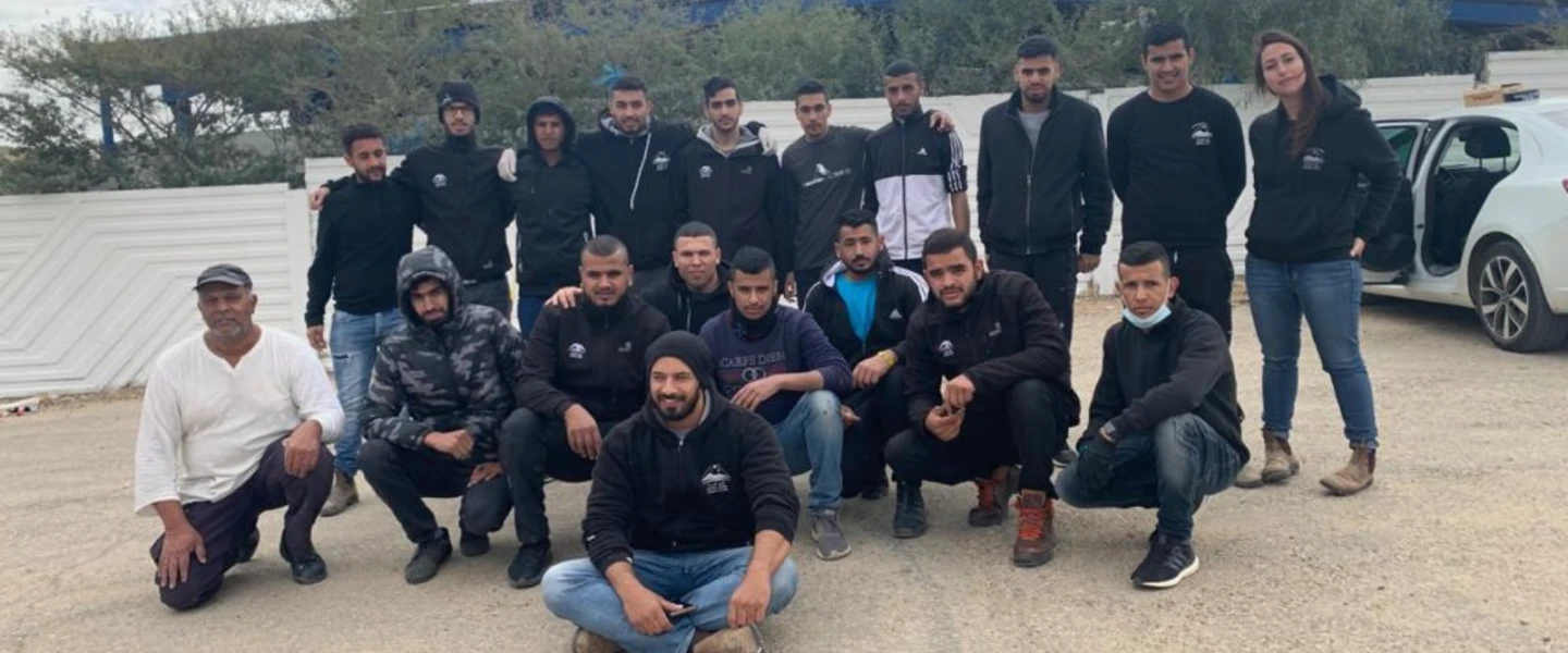 The Bedouin volunteers who fixed up a vandalized Jewish graveyard in the Negev. At left, in white, is Yochai, the cemetery’s caretaker. Photo courtesy of Desert Stars.