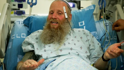 Rabbi Eitan Shnerb speaks to reporters at Hadassah Medical Center in Jerusalem's Ein Kerem, a day after being wounded in a terrorist bombing that killed his 17-year-old daughter Rina and wounded his 19-year-old son Dvir, Aug. 24, 2019. Credit: Flash90.