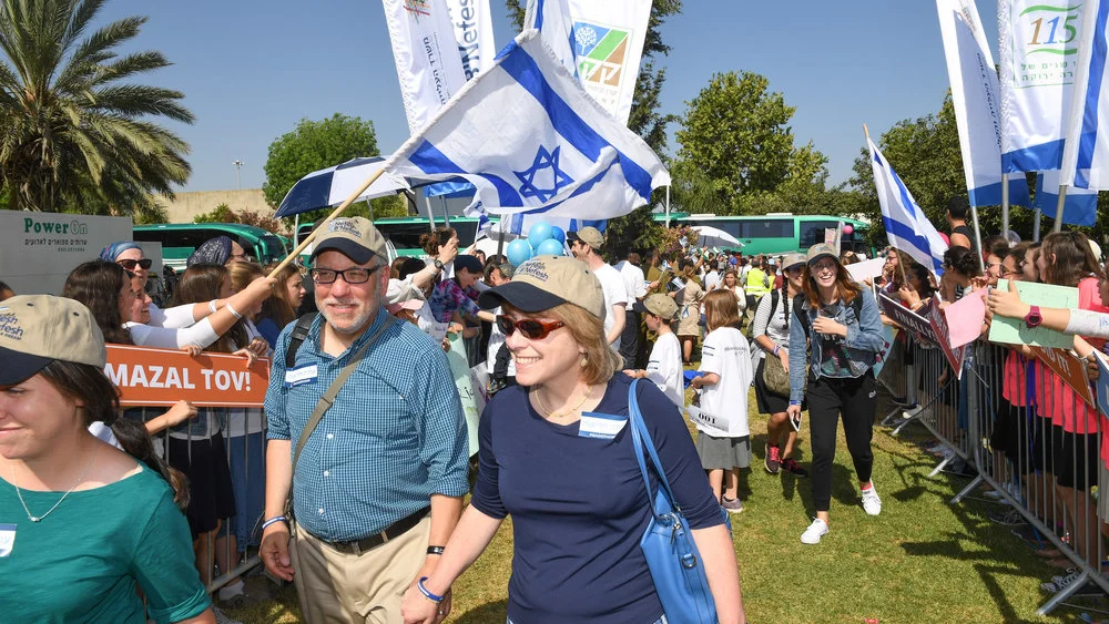 New immigrants arrive in Israel on July 4, 2017, on a flight chartered by the Nefesh B’Nefesh aliyah agency. Credit: Shahar Azran/Nefesh B’Nefesh.