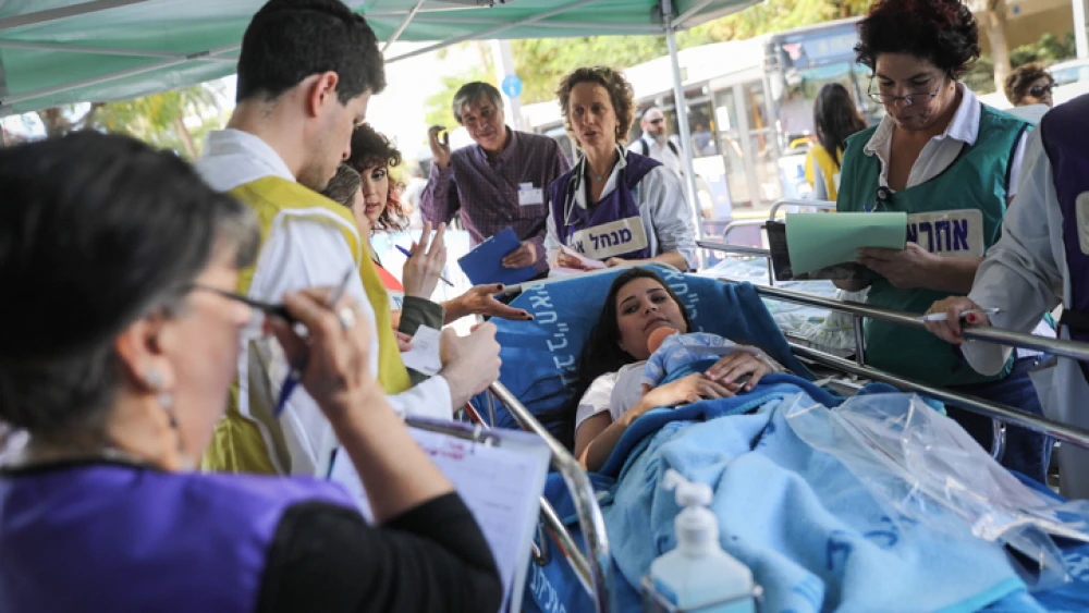 The IDF Home Front Command and Ichilov Hospital workers participate in a drill of evacuating and treating wounded in an earthquake scenario, outside the Ichilov Hospital in Tel Aviv, on Nov. 9, 2017. Photo by Hadas Parush/Flash90.