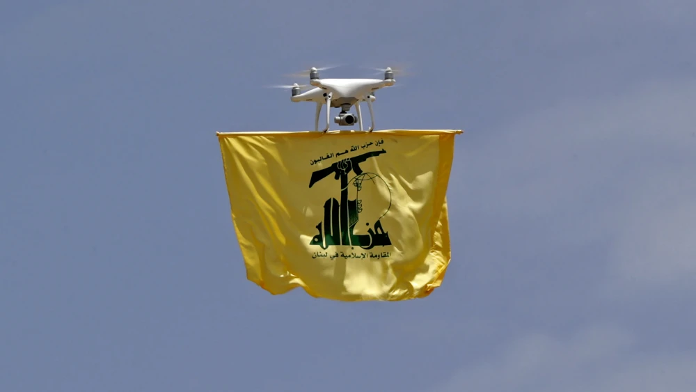 A drone carries a Hezbollah flag above Aaramta bordering Israel, ahead of the anniversary of the IDF's withdrawal from Southern Lebanon in 2000, May 21, 2023. Photo by Anwar Amro/AFP via Getty Images.