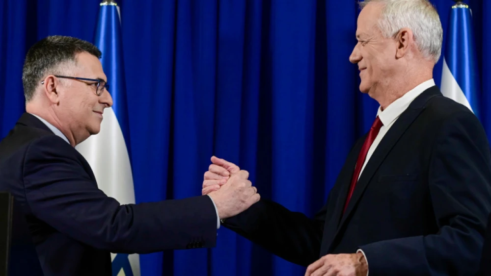 Israeli Justice Minister Gideon Sa'ar and Minister of Defense Benny Gantz hold a press conference announcing they merging their parties ahead of the upcoming election, in Ramat Gan, July 10, 2022. Photo by Tomer Neuberg/Flash90.