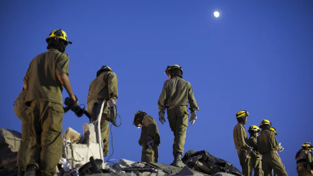 IDF Home Front Command soldiers take part in a drill simulating a building collapse following a chemical missile attack in Jerusalem on Aug. 27, 2012. Photo by Yonatan Sindel/Flash90.