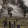 Palestinian protesters clash with Israeli soldiers near the border fence east of Gaza City on Dec. 22, 2017. Credit: Wissam Nassar/Flash90.
