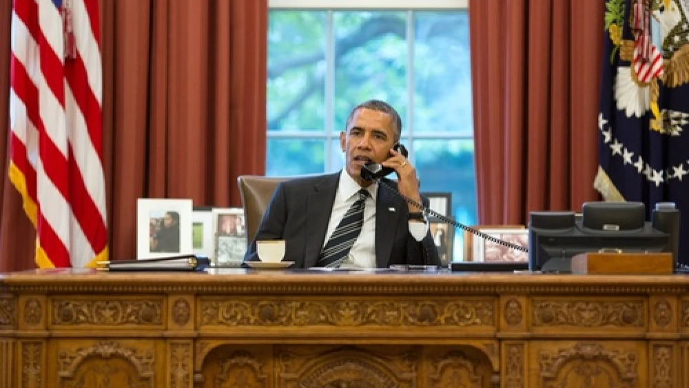 From the Oval Office, U.S. President Barack Obama speaks on the phone with Iranian President Hassan Rouhani on Sept. 27, 2013. Credit: Pete Souza/White House.