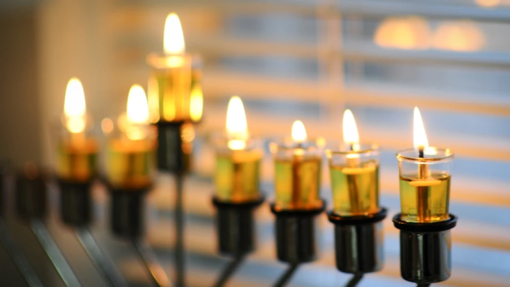 Illustration of a lit menorah on the sixth night of the Jewish holiday of Hanukkah. Photo by Mendy Hechtman/Flash90.