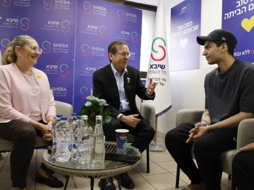 Israeli President Isaac Herzog, center, and his wife, Michal Herzog, talk with freed hostage Yosef-Haim Ohana at Sheba Medical Center in Ramat Gan on Oct. 17, 2025. Source: @Isaac_Herzog/X.