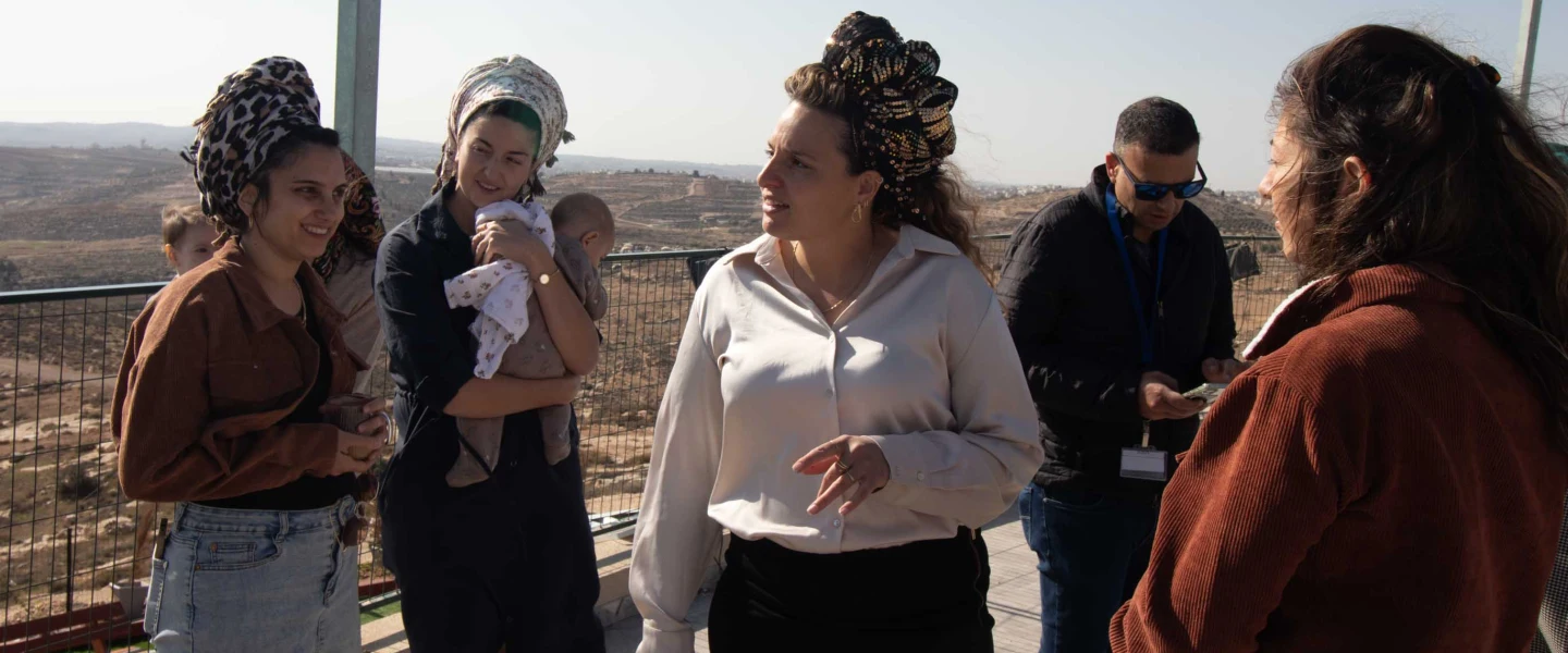 Tzofia Lichtenstein with other women from the new settlement of Mitzpe Ziv in the Hebron Hills speaks to journalists, Nov. 27, 2025. Photo by David Isaac.