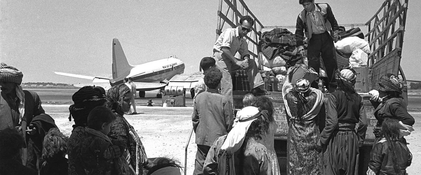 Jewish refugees from Iraq leave Lod (today Ben-Gurion) Airport, 1951. Credit: GPO via Wikimedia Commons.