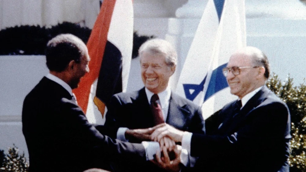 Egyptian President Anwar Sadat, U.S. President Jimmy Carter and Israeli Prime Minister Menachem Begin at the peace-treaty signing between Israel and Egypt on the White House lawn, March 26, 1979. Credit: GPO.