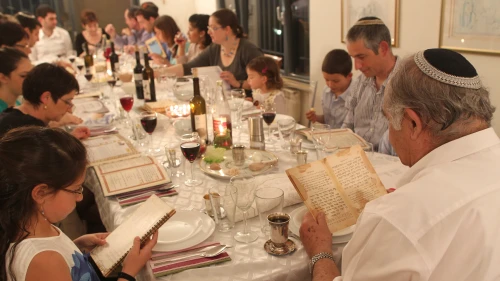 An Israeli family during the Passover seder on the first night of the holiday in Tzur Hadassah. Credit: Nati Shohat/Flash90.