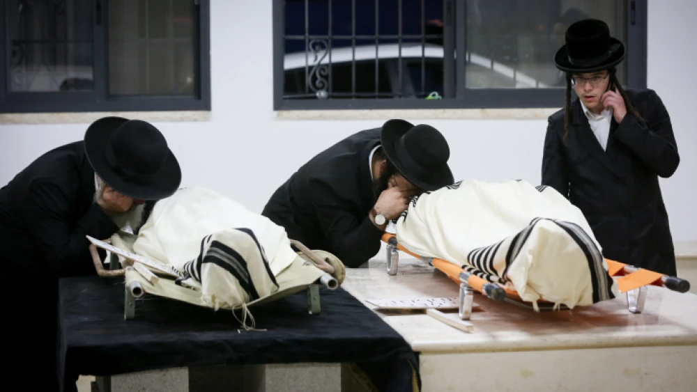Mourners attend the funeral of brothers Yosef David Elhadar and Moshe Mordechai Elhadar, two victims of the stampede in Meron during the celebration of Lag B'Omer, May 2, 2021. Photo by David Cohen/Flash90.