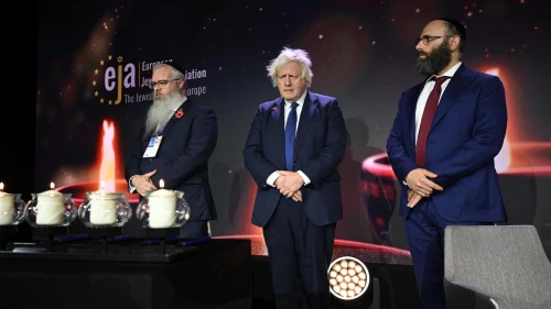 Rabbi Daniel Walker, left, Boris Jognson and Rabbi Menachem Margolin commemorate Jewish terror vitims in Krakow, Poland on Nov. 4, 2025. Photo by Yoav Dudkevitch/EJA.