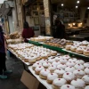 Doughnuts at the Haba bakery at Jerusalem's Machane Yehuda market ahead of Hanukkah, Dec. 7, 2020. Photo by Yonatan Sindel/Flash90.