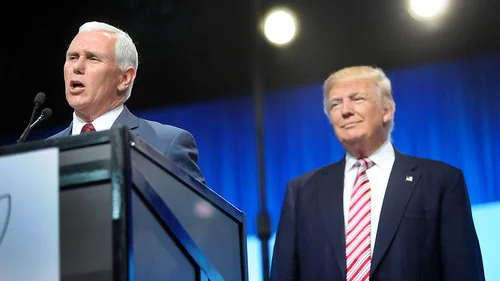 Republican presidential nominee Donald Trump watching his vice-presidential running mate Mike Pence give a speech. Credit: Getty Images.