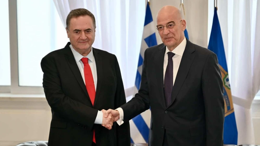 Israel's Defense Minister Israel Katz shakes hands with his Greek counterpart Nikos Dendias at the Ministry of Defense in Athens, Greece, Jan. 20, 2026. Source: @NikosDendias/X.