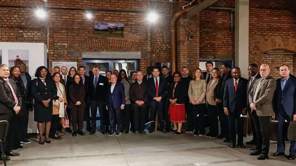 Danny Danon, waering a red tie and standing left of the woman in red, leads U.N. ambassadors at Oskar Schildner's former factory in Krakow, Poland on Feb. 18, 2026. Photo courtesy of Danon's office.