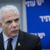 Israeli opposition leader Yair Lapid (Yesh Atid Party) leads a faction meeting at the Knesset, the Israeli parliament in Jerusalem, Nov. 24, 2025. Photo by Chaim Goldberg/Flash90.