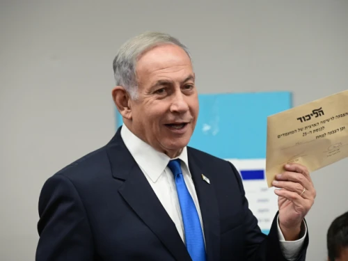 Likud Party Chairman Benjamin Netanyahu, then leader of the opposition, prepares to cast his vote in the Likud primary at a polling station in Tel Aviv on Aug. 10, 2022. Photo by Tomer Neuberg/Flash90.