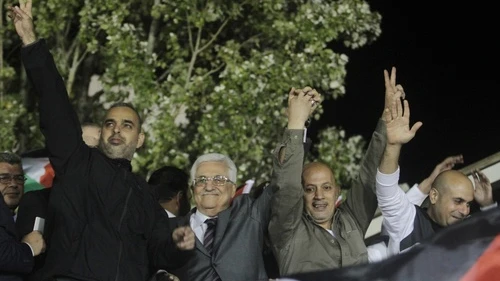 Palestinian Authority leader Mahmoud Abbas (second from left) waves with Palestinian prisoners released from Israeli jails during celebrations in Ramallah, Oct. 30, 2013. Photo by Issam Rimawi/Flash90.