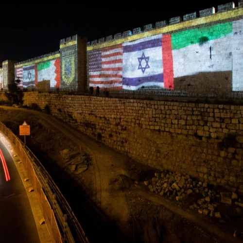 The flags of the U.S., the United Arab Emirates, Israel and Bahrain are screened on the walls of Jerusalem's Old City on Sept. 15, 2020. Photo: Yonatan Sindel/Flash90.